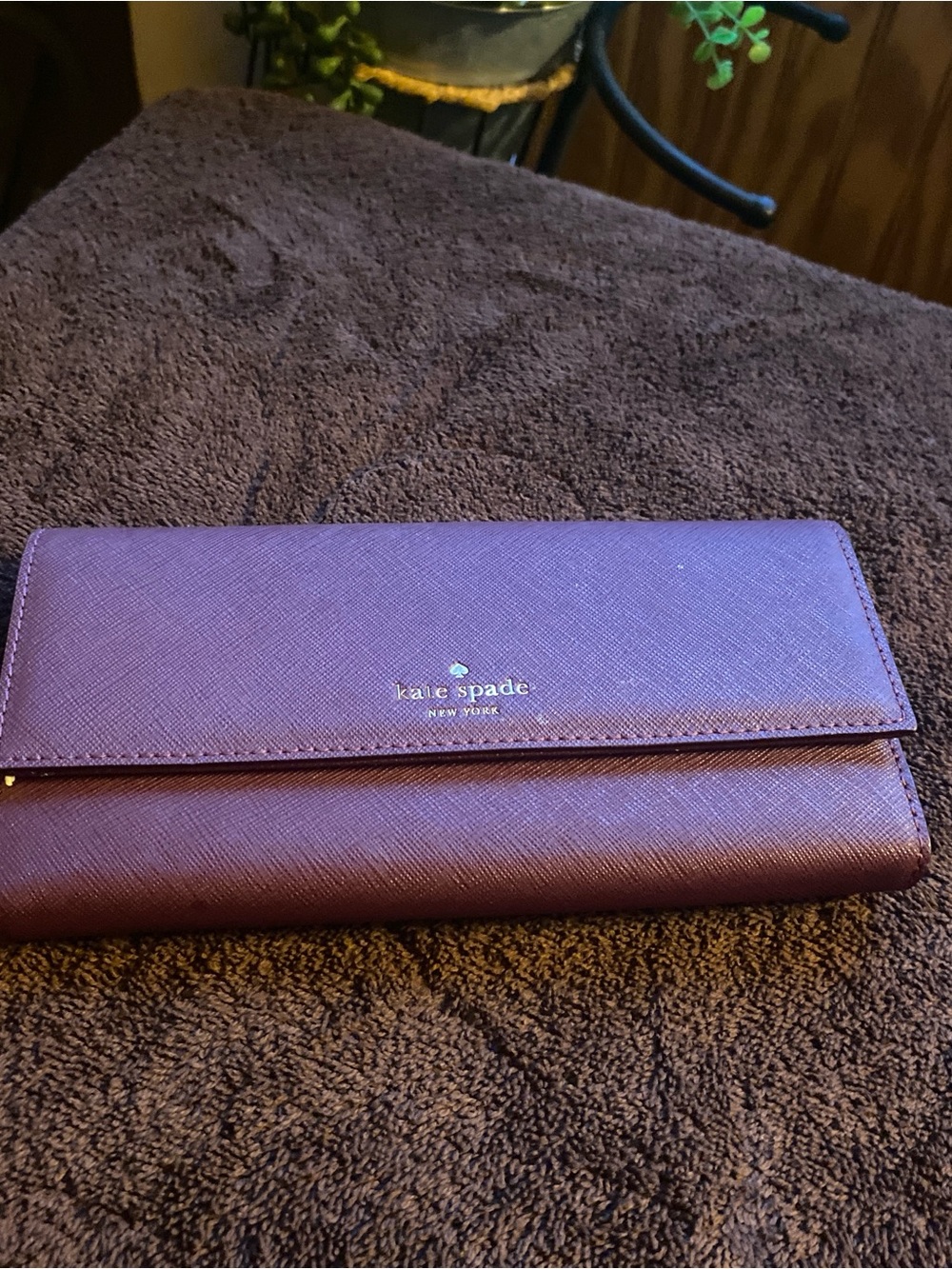 kate spade plum saffiano continental wallet with gold logo